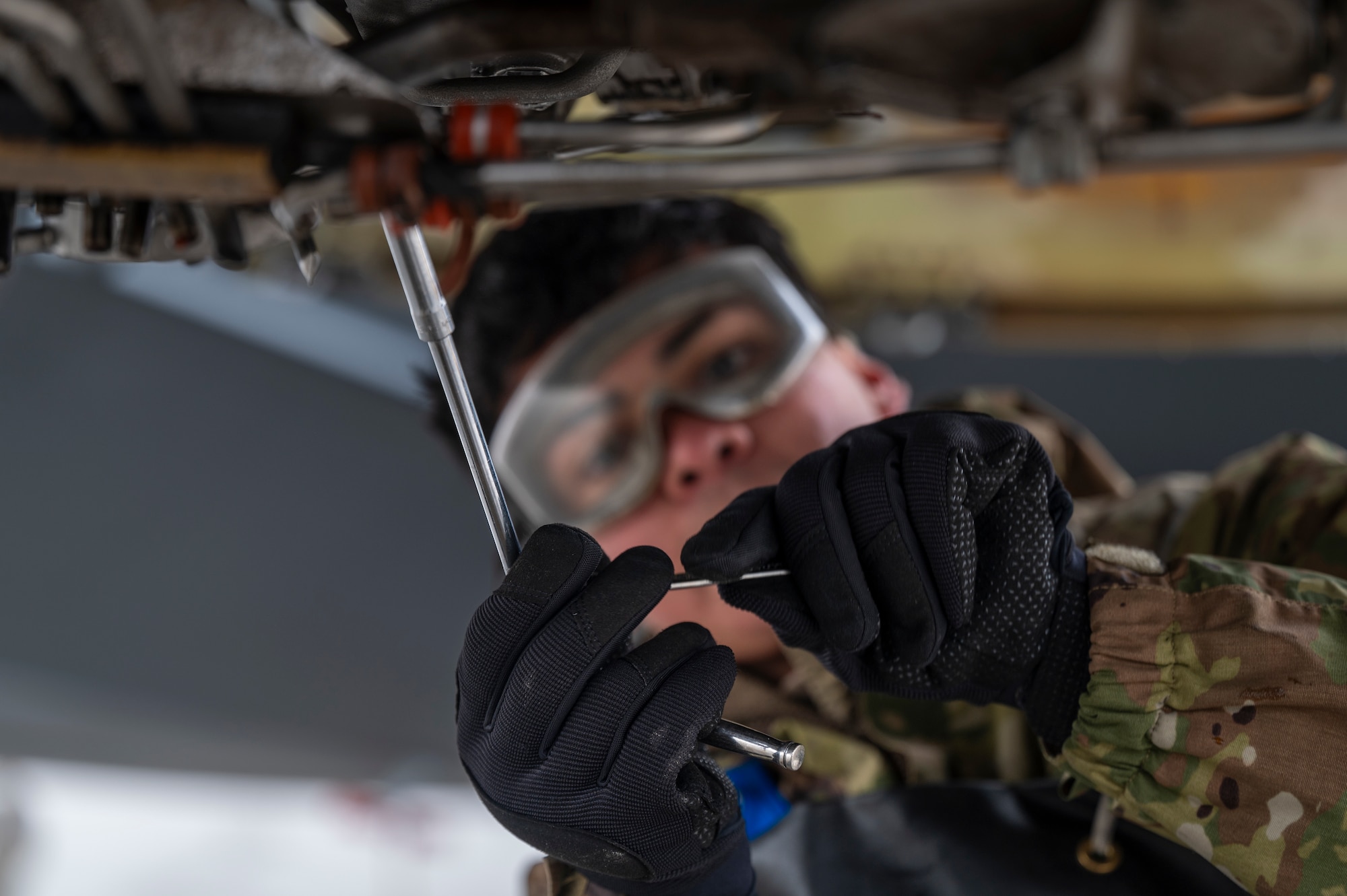U.S. Air Force Airman Miguel Guerrero, an aerospace propulsion specialist assigned to the 92nd Maintenance Squadron, removes fuel filters during exercise Mobility Response 25 in support of U.S. Strategic Command exercise Global Thunder 25 at Fairchild Air Force Base, Washington, Oct. 23, 2024. Guerrero performed routine maintenance during exercise MR25 to ensure aircraft are fully operational, safe, and ready for critical missions. Executing training exercises like MR25 prepare wings to support the warfighter at the furthest node to ensure light, lean, and distributed operations. (U.S. Air Force photo by Airman 1st Class Stassney Davis)