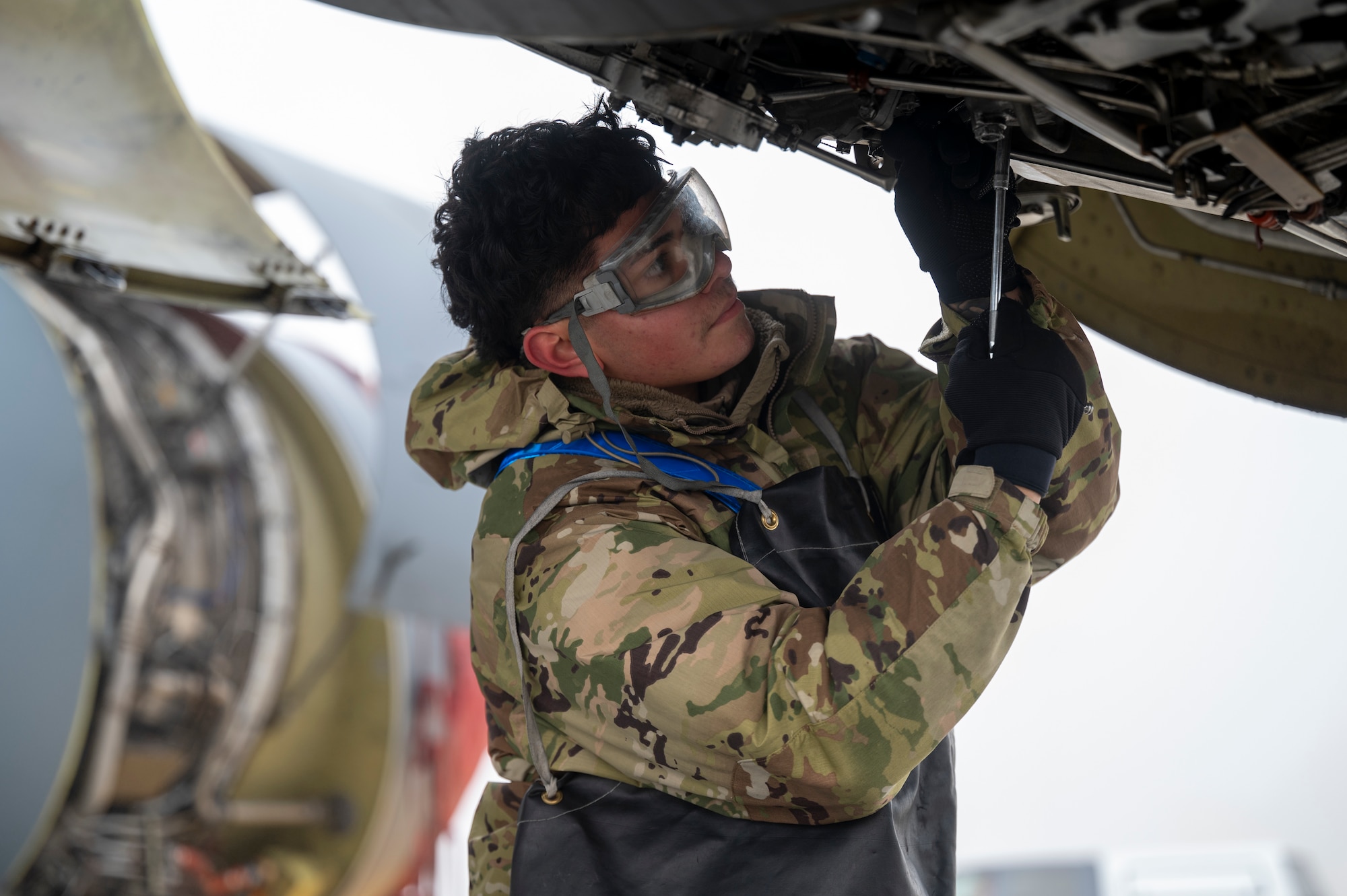 U.S. Air Force Airman Miguel Guerrero, an aerospace propulsion specialist assigned to the 92nd Maintenance Squadron, removes fuel filters during exercise Mobility Response 25 in support of U.S. Strategic Command exercise Global Thunder 25 at Fairchild Air Force Base, Washington, Oct. 23, 2024. Airmen performed inspections to ensure the KC-135 Stratotanker remains reliable and mission ready. The role of the KC-135 in this exercise underscores Fairchild’s dedication to provide rapid global mobility. (U.S. Air Force photo by Airman 1st Class Stassney Davis)