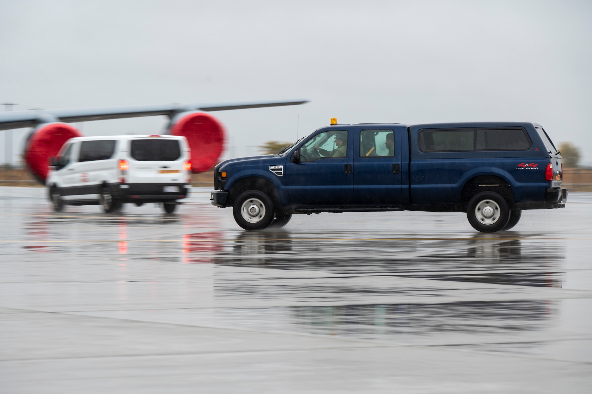 A car is driven on the flightline