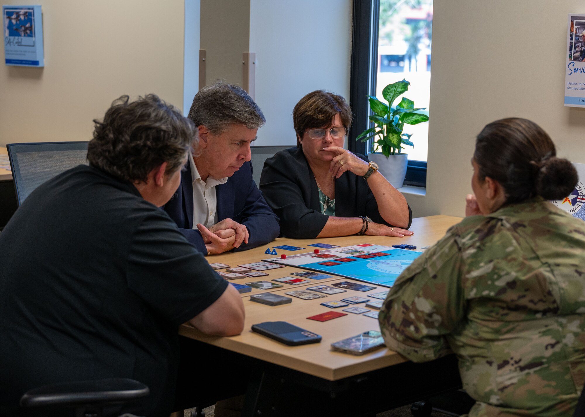 Civilian Intelligence Functional Advisory Council members are taught how to play the Air Force Wargame Indo-Pacific at Maxwell Air Force Base, Alabama, Oct. 24, 2024. Air Force Wargame Indo-Pacific allows Airmen to familiarize themselves with multidomain integration and Agile Combat Employment without having to dedicate more than a few hours to the game. (U.S. Air Force photo by Senior Airman Evan Lichtenhan)