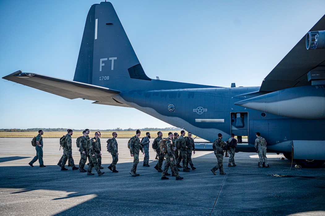 U.S. Air Force Airmen assigned to the 71st Rescue Squadron and German military members approach an HC-130J Combat King II at Moody Air Force Base, Georgia, Oct. 23, 2024. Over the course of three days, Airmen demonstrated Forward Area Refueling Point techniques to their visiting counterparts. (U.S. Air Force photo by Senior Airman Leonid Soubbotine)