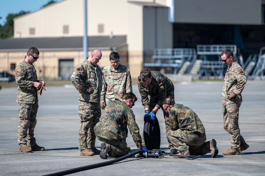 U.S. Air Force Airmen assigned to the 23rd Logistics Readiness Squadron and German military members perform Forward Area Refueling Point training at Moody Air Force Base, Georgia, Oct. 23, 2024. Over the course of three days of classroom instruction and hands-on training, Moody AFB Airmen shared their experience, techniques with NATO partner troops. (U.S. Air Force photo by Senior Airman Leonid Soubbotine)