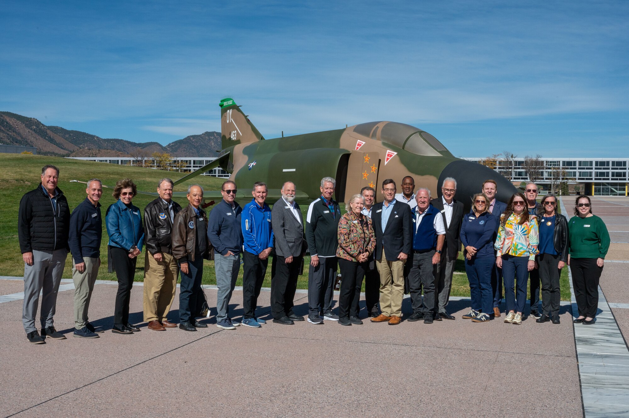 Department of the Air Force civic leaders gather in front of a U.S. Air Force F-4 Phantom II static display during a tour at the U.S. Air Force Academy, Colorado on October 23, 2024.