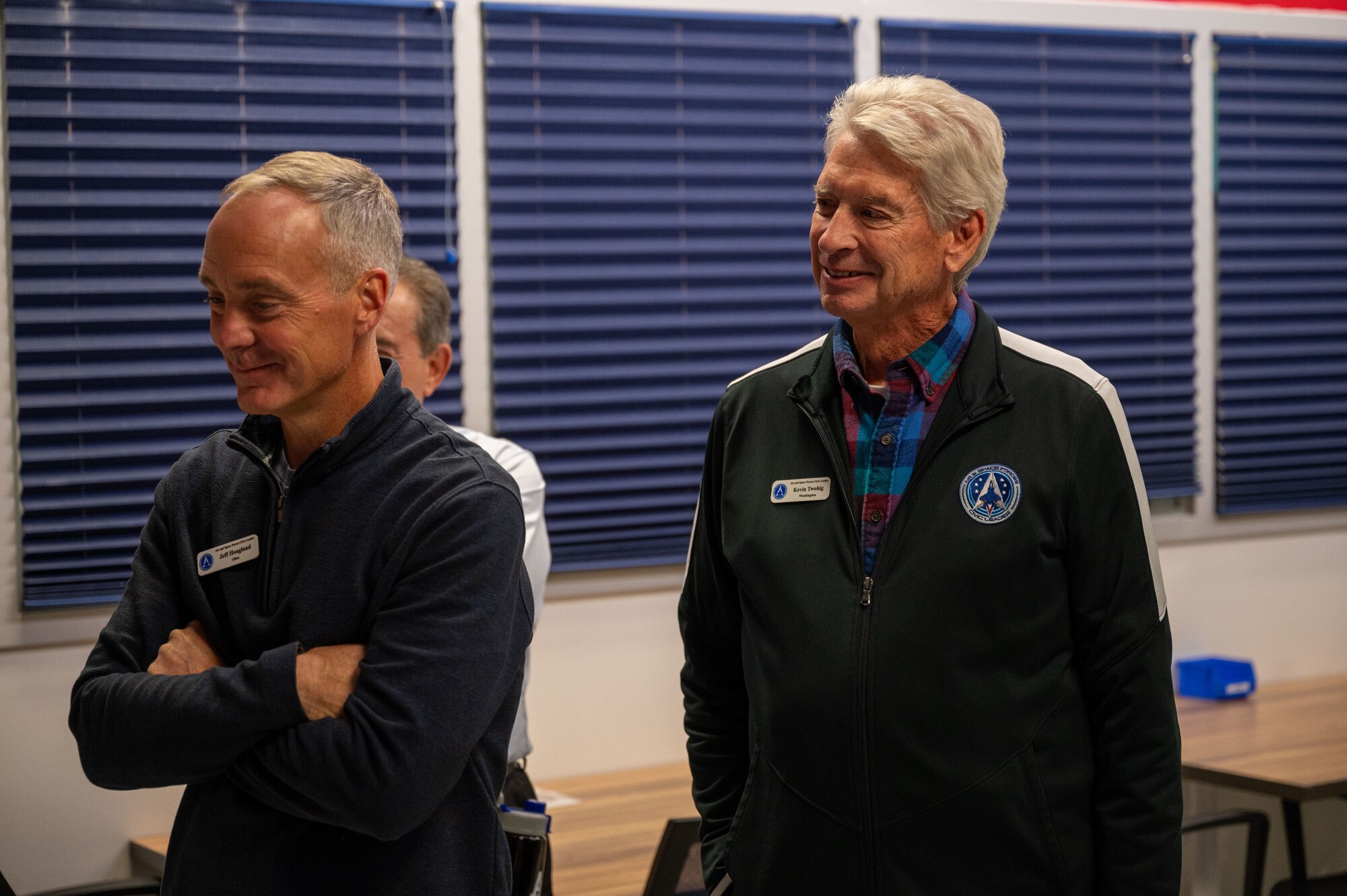 Two men stand next to each other as they receive a briefing from an individual, not pictured, during a tour at the U.S. Air Force Academy, Colorado on October 23rd 2024.