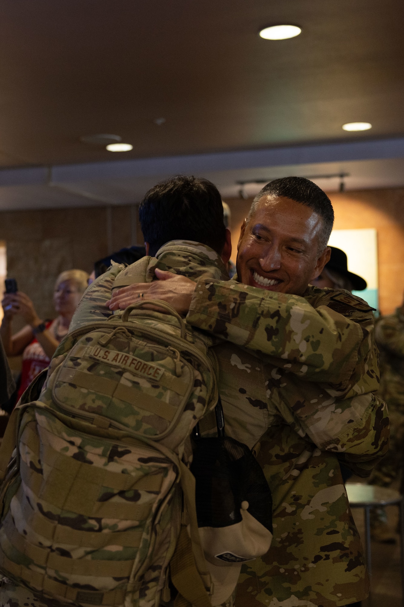 U.S. Air National Guard Lt. Col. Jason Gonzales, 162nd Wing Security Forces Squadron commander welcomes an Airman returning from deployment in Tucson, Ariz., Oct. 13, 2024. The 162nd Wing Defenders returned home following a deployment supporting more than 4,000 joint and 8,500 coalition forces in the U.S. Central Command Area Of Responsibility. (U.S. Air National Guard photo by Senior Airman Guadalupe Beltran)