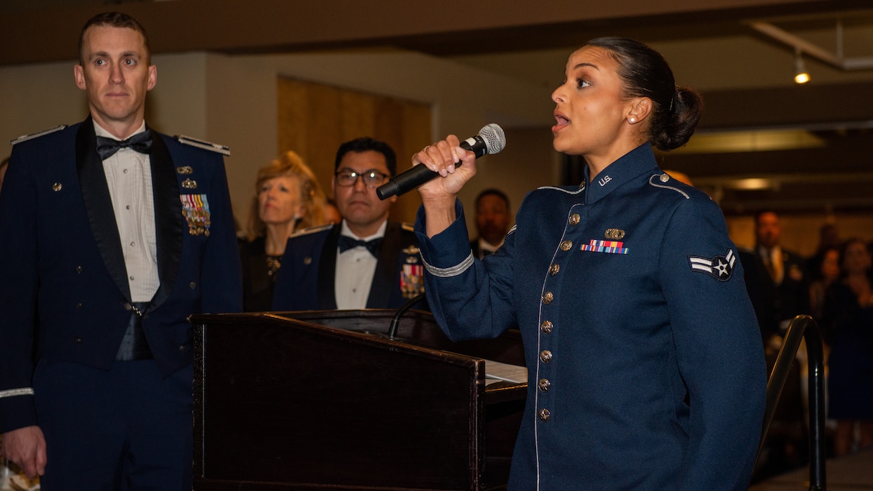 Airman singing the National Anthem