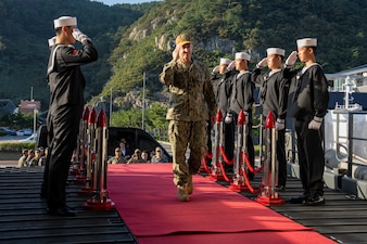 Adm. Steve Koehler salutes sideboys aboard ROKS Marado (LPH-6112) in Busan, South Korea.