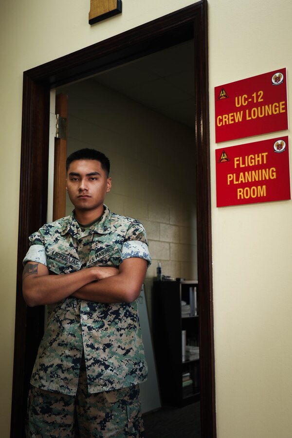 U.S. Marine Corps Lance Cpl. Andi LopezRojas, an aviation operations specialist with Headquarters and Headquarters Squadron, Marine Corps Air Station (MCAS) New River, poses for a photo outside of his office on MCAS New River in Jacksonville, North Carolina, Oct. 22, 2024. LopezRojas, the recipient of the October 2024 MCAS New River Go-Getter award, is a New Jersey native and enlisted in the Marine Corps in 2022. (U.S. Marine Corps photo by Cpl. Zeta Johnson)