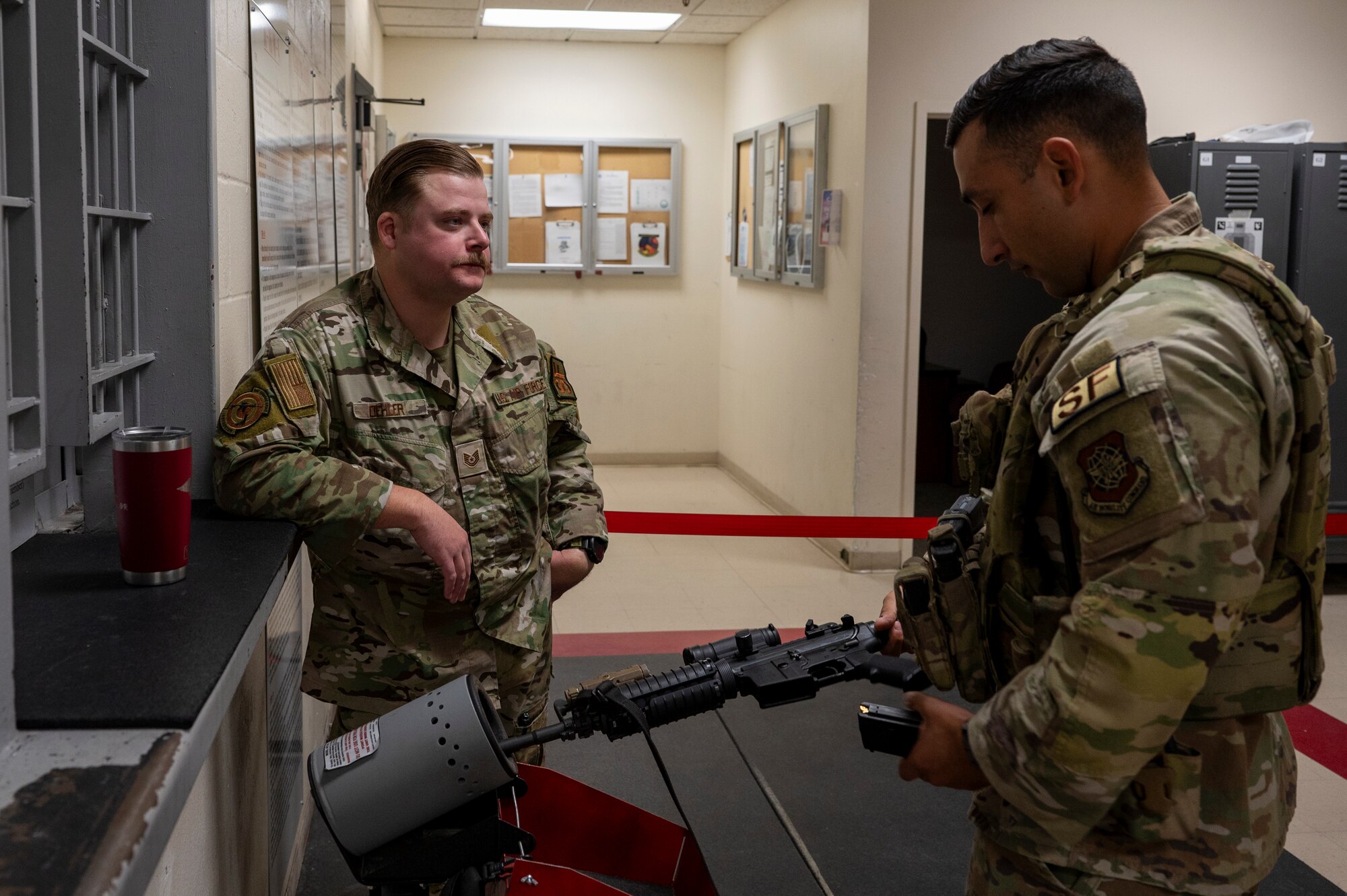 U.S. Air Force Tech. Sgt. Greyson Oehler, a combat arms trainer assigned to the 92nd Security Forces Squadron, supervises safety checks as the clearing duty official during exercise Mobility Response 25 in support of U.S. Strategic Command exercise Global Thunder 25 at Fairchild Air Force Base, Washington, Oct. 20, 2024. Oehler observed weapons checks to promote safety and prevent accidental discharges. Mobility Response is an opportunity for Mobility Air Force to test their ability to respond to and simultaneously support multiple combatant commander’s requirements, such as USSTRATCOM’s reliable strategic deterrence force. (U.S. Air Force photo by Airman 1st Class Samantha Thorn)