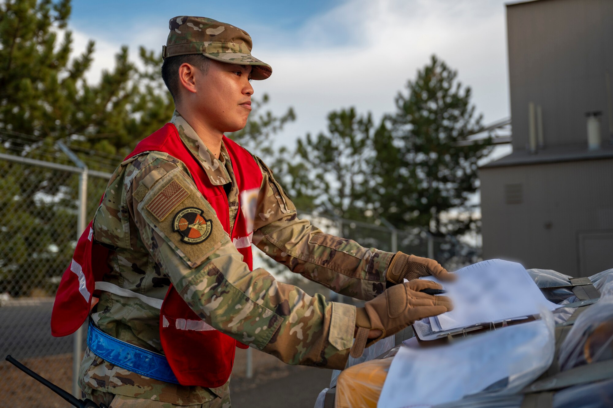 An Airman verifies paperwork