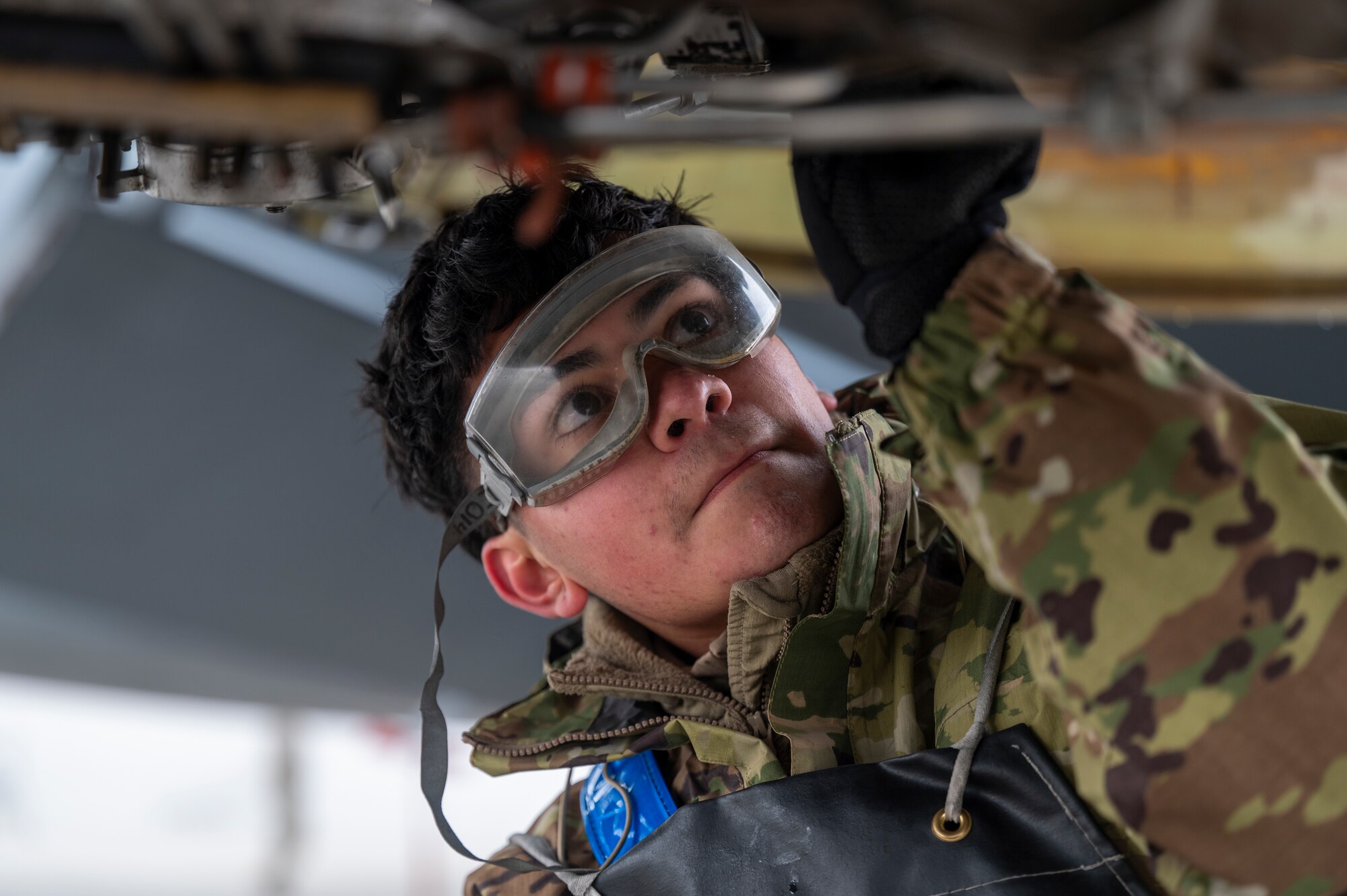 U.S. Air Force Airman Miguel Guerrero, an aerospace propulsion specialist assigned to the 92nd Maintenance Squadron, removes fuel filters during exercise Mobility Response 25 in support of U.S. Strategic Command exercise Global Thunder 25 at Fairchild Air Force Base, Washington, Oct. 23, 2024. The KC-135 Stratotanker played a crucial role in this exercise and GT25, providing essential air-to-air refueling capabilities that are vital for sustaining long-range operations. (U.S. Air Force photo by Airman 1st Class Stassney Davis)