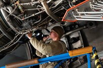 U.S. Airman 1st Class Hector Huerta, 736th Aircraft Maintenance Squadron aerospace propulsion journeyman, performs an inspection on a C-17 Globemaster III engine at Dover Air Force Base, Delaware, Oct. 15, 2024. Huerta and other maintainers performed the task as part of a C-17 Home Station Check which is accomplished every 180 days. (U.S. Air Force photo by Roland Balik)