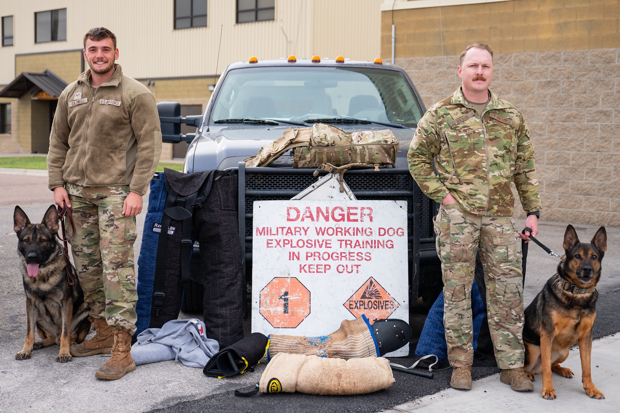 Uniformed personnel stand together for a photo.