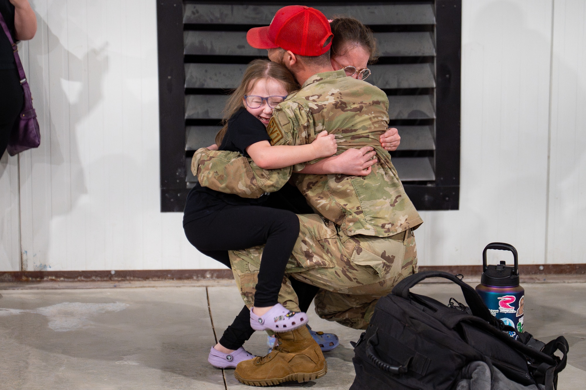 Uniformed personnel stand together in a photo.