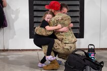 Uniformed personnel stand together in a photo.
