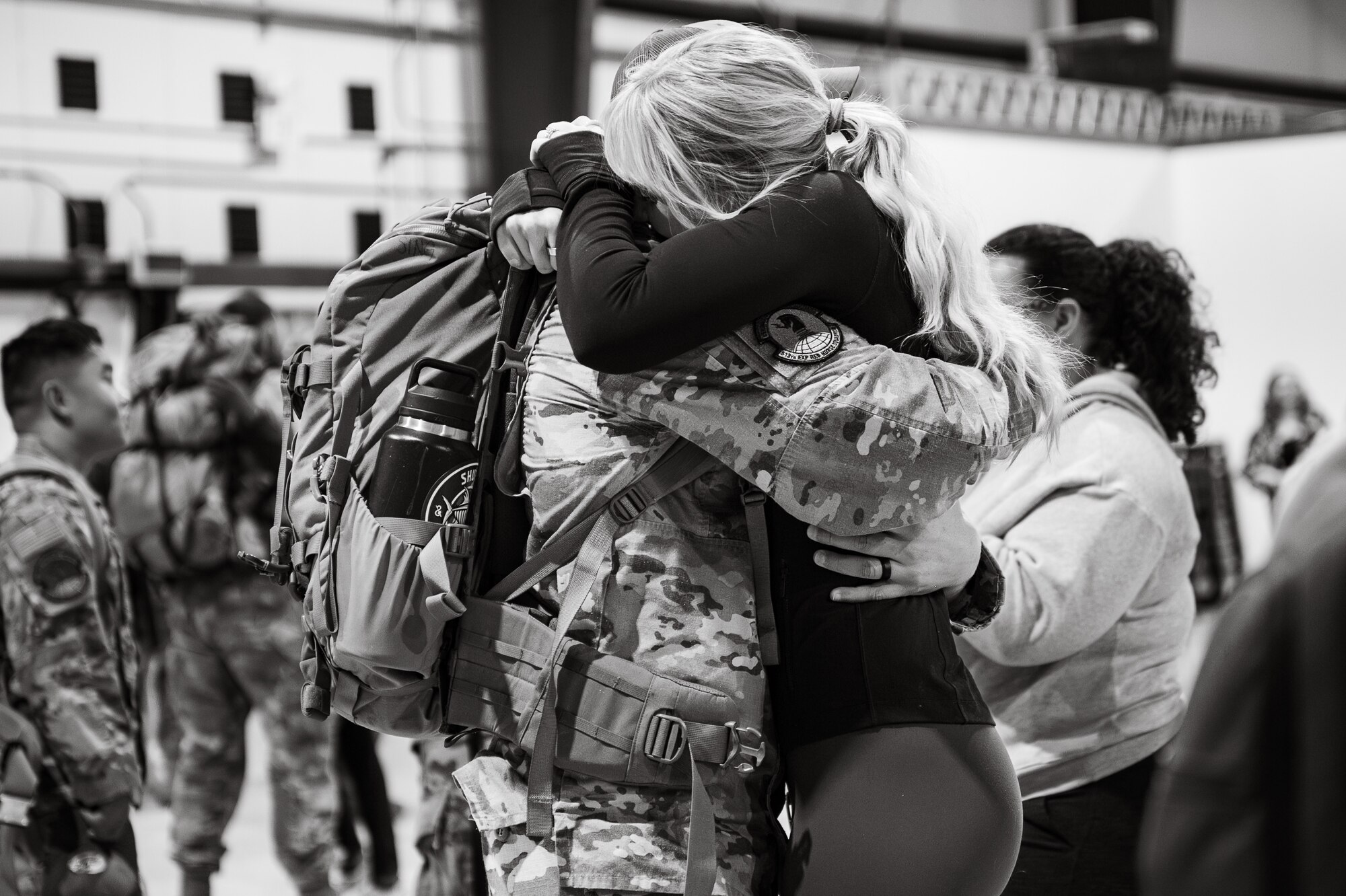 Uniformed personnel stand together in a photo.