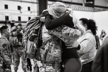 Uniformed personnel stand together in a photo.