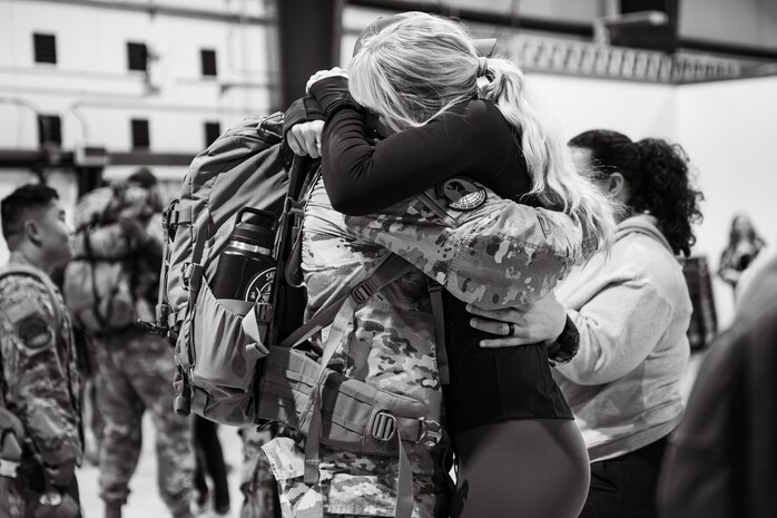 Uniformed personnel stand together in a photo.