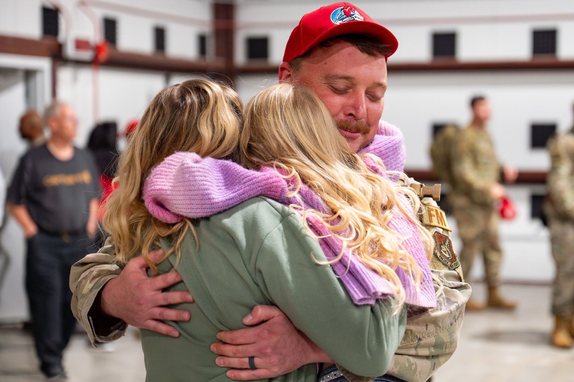 Uniformed personnel stand together in a photo.