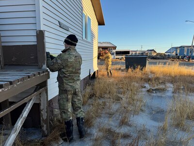 Members of the Alaska Organized Militia assigned to Joint Task Force Kotzebue assess priority-one damaged homes in the Arctic Circle community of Kotzebue, Oct. 26, 2024. The team’s measurements will help local emergency managers determine supplies needed to repair and rebuild structures impacted by severe flooding along Alaska’s West Coast. Many buildings in the area sustained foundation, sub-floor, and insulation damage due to the storm. The 11-member team, including personnel from the Alaska Air and Army National Guard and the Alaska State Defense Force, was activated by the State Emergency Operations Center to support response and recovery efforts.