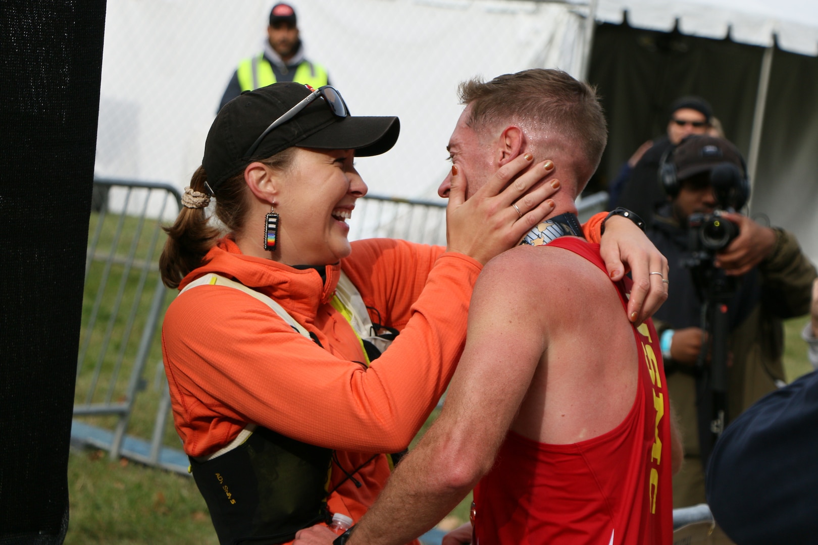 Marine Major Kyle King hugs his girlfriend Hope Sweetnam after winning the 49th Marine Corps Marathon and the 2024 Armed Forces Marathon Championship in Washington, D.C.  The Armed Forces Championship features teams from the Army, Marine Corps, Navy (with Coast Guard runners), and Air Force (with Space Force Runners).  Department of Defense Photo by Mr. Steven Dinote - Released.