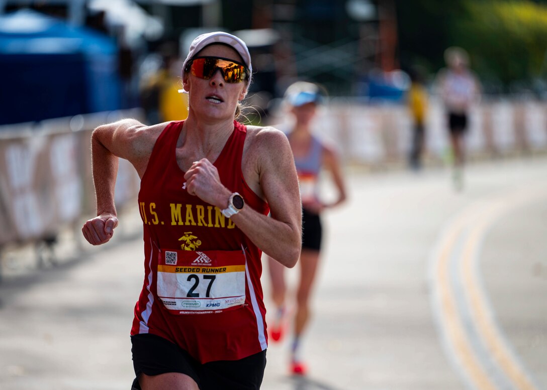 Marine Major Mollie Geyer of MCAS Miramar, Calif. crosses the finish line with a time of 2:57:09, taking Armed Forces Silver. 
 The 2024 Armed Forces Marathon Championships held in conjunction with the 49th Marine Corps Marathon on Sunday, October 27th. Service members from the Army, Marine Corps, Navy (with Coast Guard runners, and Air Force (with Space Force runners) go for gold.  Visit www.ArmedForcesSports.defense.gov to learn more about the Armed Forces Sports program and the other sports offered. (Department of Defense photo by MC2 Colby A. Mothershead – released).