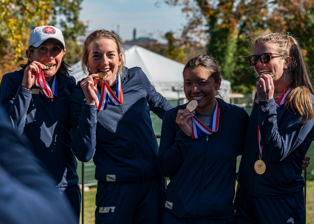 The All-Navy Women's Marathon Team captures gold.  LT Megan Walsh, NB San Diego, CA; LT Madison Overby, NS Norfolk, VA; CDR Gina Slaby, Naval Base Kitsap, WA; LT Rachel Burchill, University of New Orleans.  The 2024 Armed Forces Marathon Championships held in conjunction with the 49th Marine Corps Marathon on Sunday, October 27th. Service members from the Army, Marine Corps, Navy (with Coast Guard runners, and Air Force (with Space Force runners) go for gold.  Visit www.ArmedForcesSports.defense.gov to learn more about the Armed Forces Sports program and the other sports offered. (Department of Defense photo by MC2 Colby A. Mothershead – released).