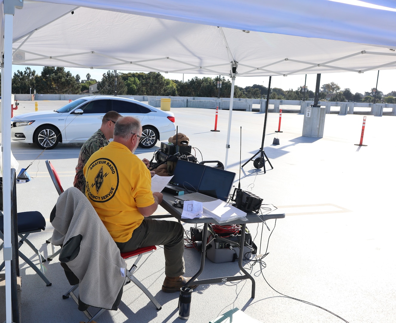 Tim Marshall, a volunteer with ARES and a retired Navy chief petty officer, and Navy Lt. Arion McCartney, Naval Hospital Camp Pendleton Chief Information Officer, identify other amateur radio callsigns during the San Diego County 2024 Pediatric Surge Full Scale Exercise on Oct. 24, 2024, aboard Marine Corps Base Camp Pendleton. The hospital’s goals were to practice communication support during an event with degraded communication assets and to stress interoperability and collaboration with other agencies across the county. “We successfully achieved our objectives during this exercise by seamlessly integrating ARES volunteers into our emergency response framework, enabling efficient backup communication, enhancing resource coordination, and providing real-time situational awareness,” said McCartney. “Our successful collaboration with ARES volunteers and partner agencies demonstrated our ability to effectively manage a large-scale disaster scenario, ensuring that critical information and resources were available to support healthcare facilities and protect our community.”