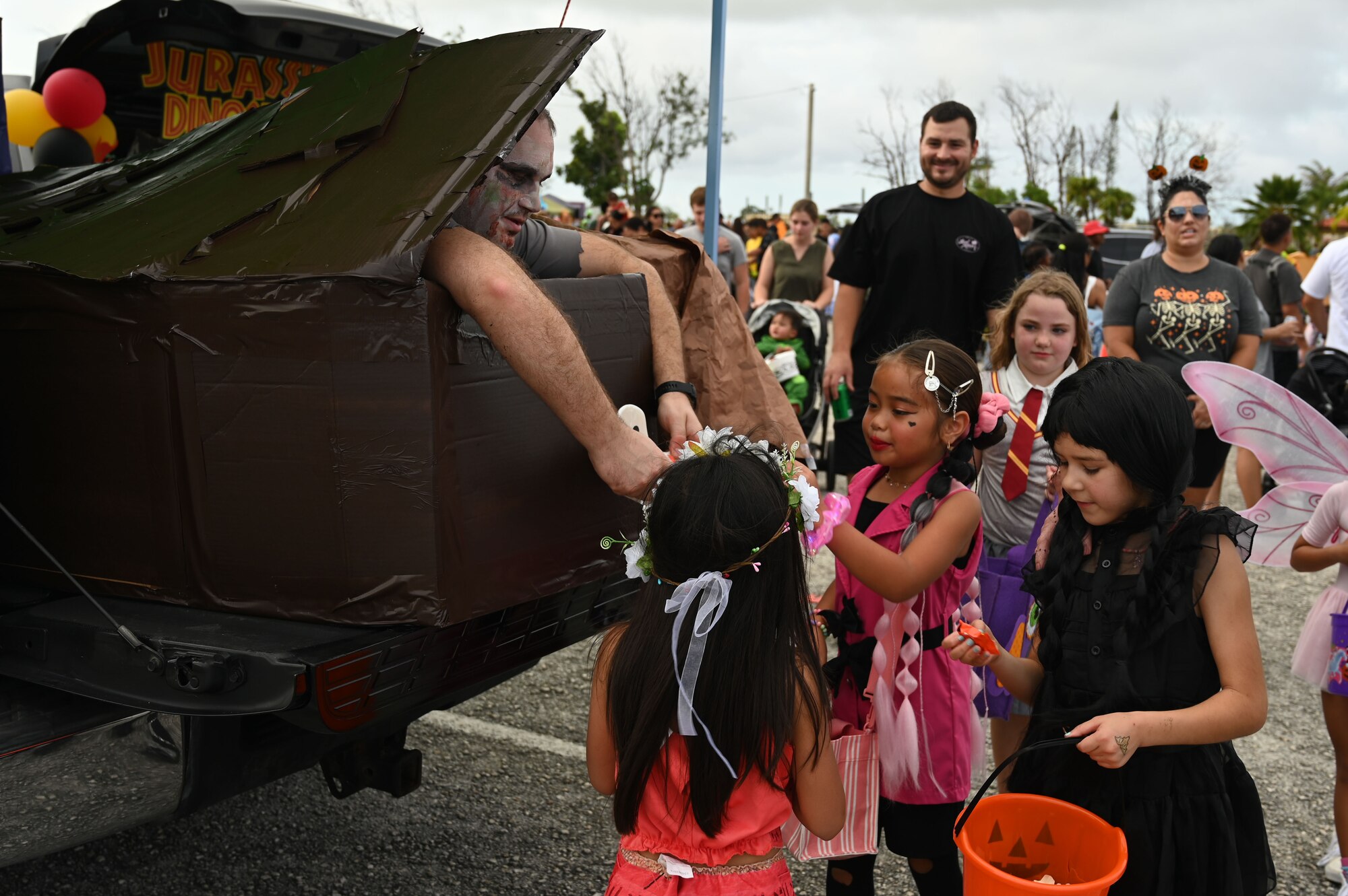 Children participate in trick-or-treating during the Trunk-or-Treat event.