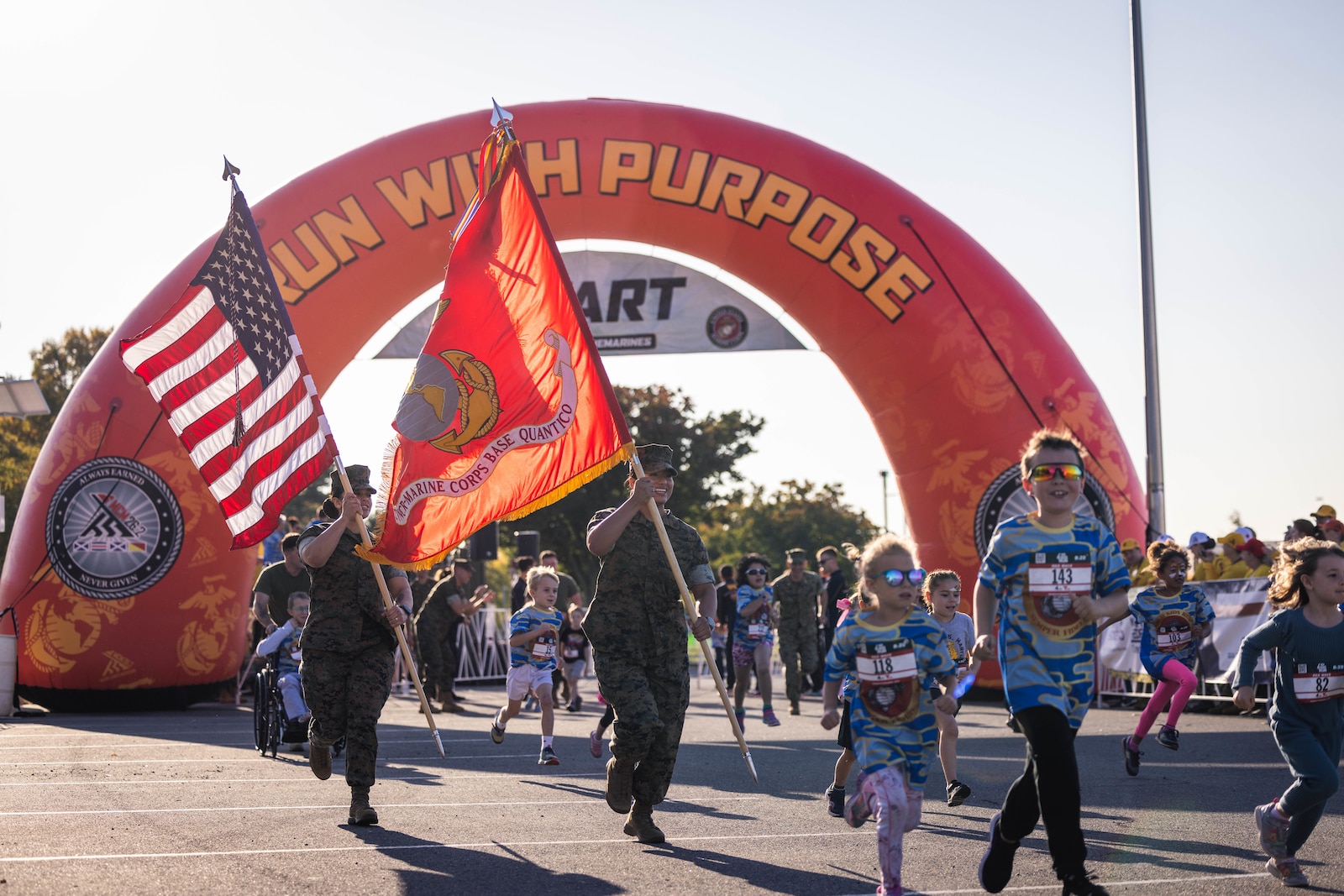 Kids race to the finish during the Marine Corps Marathon Kids Run at the Pentagon in Arlington, Virginia, Oct. 26, 2024. The one mile fun run offered children ages 5-12 the opportunity to run with Marines; finishing at Camp Miles where families were able to enjoy activities, entertainment, and games. (U.S. Marine Corps photo by Lance Cpl. Joaquin Dela Torre)