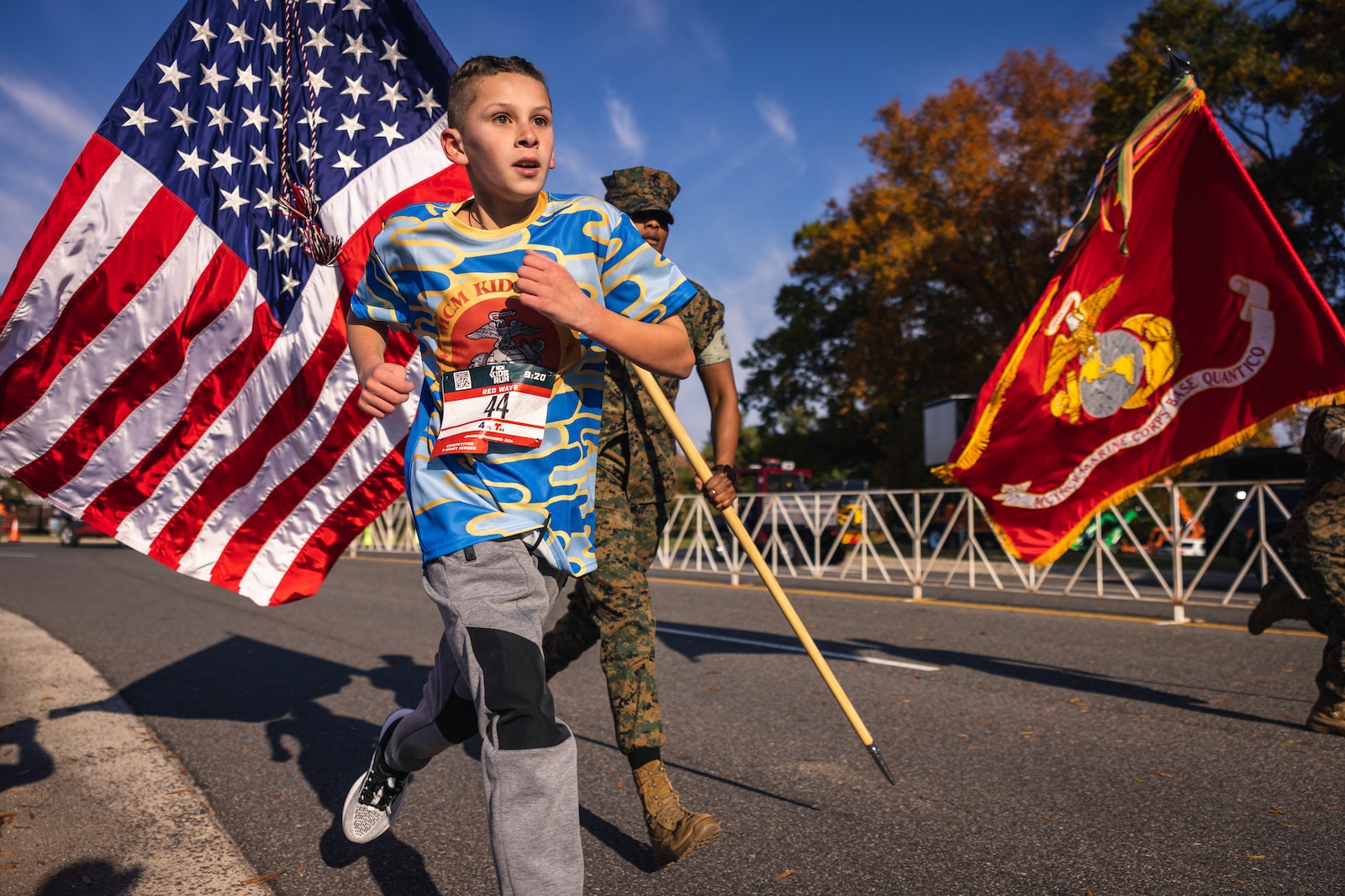 Kids race to the finish during the Marine Corps Marathon Kids Run at the Pentagon in Arlington, Virginia, Oct. 26, 2024. The one mile fun run offered children ages 5-12 the opportunity to run with Marines; finishing at Camp Miles where families were able to enjoy activities, entertainment, and games. (U.S. Marine Corps photo by Lance Cpl. Joaquin Dela Torre)