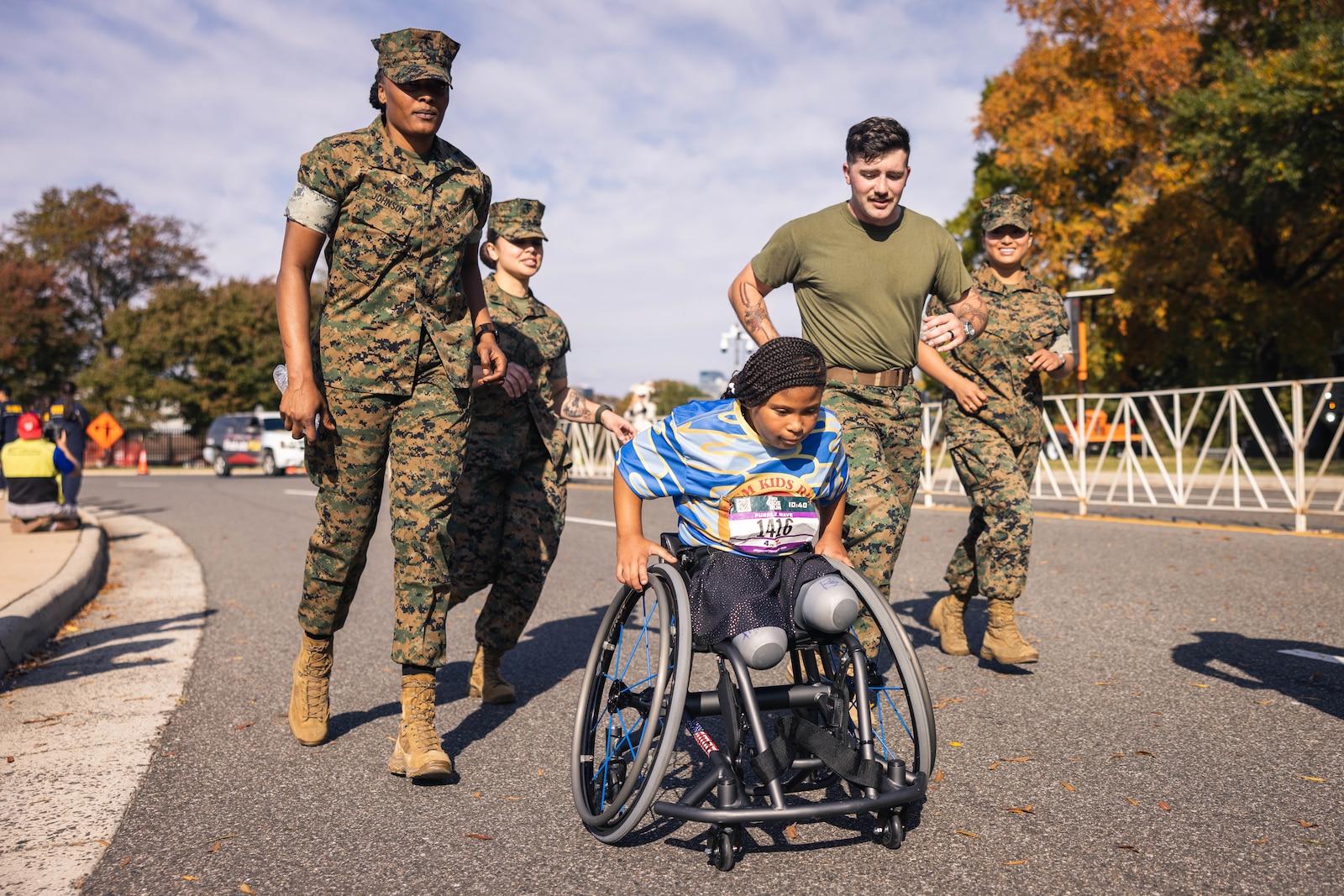 Kids race to the finish during the Marine Corps Marathon Kids Run at the Pentagon in Arlington, Virginia, Oct. 26, 2024. The one mile fun run offered children ages 5-12 the opportunity to run with Marines; finishing at Camp Miles where families were able to enjoy activities, entertainment, and games. (U.S. Marine Corps photo by Lance Cpl. Joaquin Dela Torre)