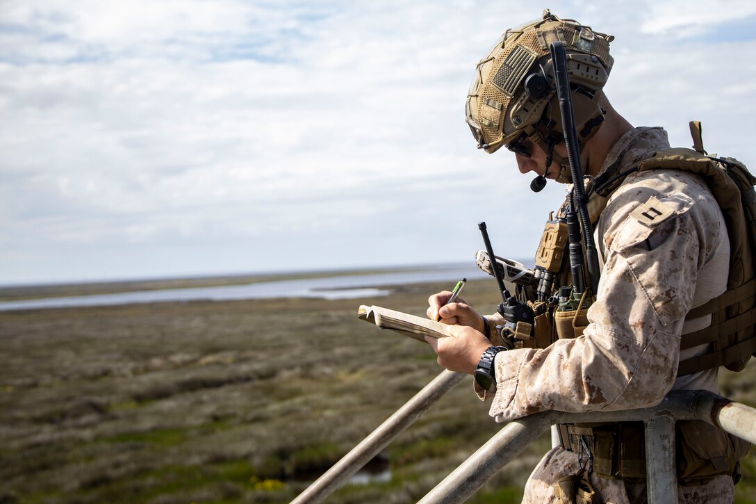 U.S. Marine Corps Capt. Todd Schievelbein, a fire support coordinator with 2nd Air Naval Gunfire Liaison Company, II Marine Expeditionary Force Information Group, takes notes during exercise Burmese Chase 24 at Bombing Target 11, Piney Island, North Carolina, Sept. 12, 2024. Burmese Chase is an annual U.S. led, multi-lateral exercise that includes training on integration of ground and air fires, infantry tactics and naval gunfire alongside NATO allies. (U.S. Marine Corps photo by Cpl. Jacquilyn Davis)