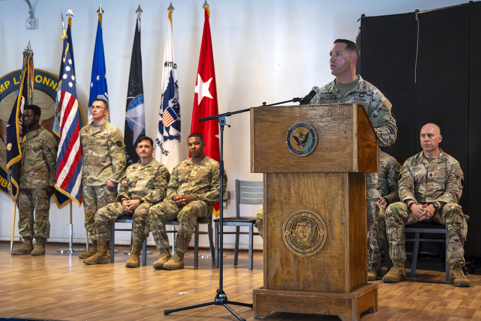 U.S. Army Lt. Col. David Fittipoldi, Task Force Associator commander, welcomes his Soldiers to Combined Joint Task Force - Horn of Africa during a transfer of authority ceremony at Camp Lemonnier, Djibouti Oct. 21, 2024. Soldiers from Task Force Paxton relinquished command security forces to Task Force Associator, another Pennsylvania National Guard Unit. (U.S. Army National Guard photo by SGT. Lark Sine)