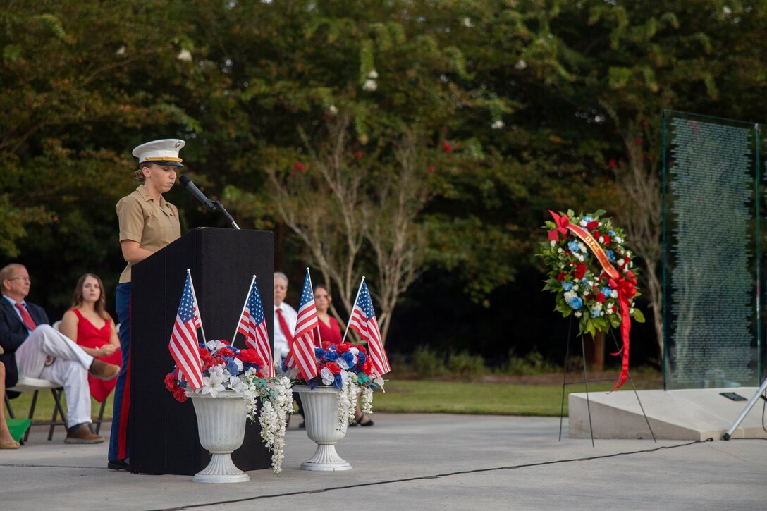U.S. Marine Corps 1st Lt. Hunter Lare, a cyber warfare officer with 8th Communication Battalion, II Marine Expeditionary Force Information Group, gives remarks during a candlelight vigil at the Lejeune Memorial Gardens, Jacksonville, North Carolina, August 26, 2024. The candlelight vigil was led by volunteers with Remember Everyone Deployed on the third-year anniversary of the attack at Abbey Gate, Kabul, Afghanistan. (U.S. Marine Corps photo by Cpl. Jacquilyn Davis)