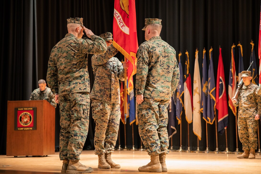 U.S. Marine Corps Lt. Col. Ruth Kehoe, off-going commanding officer of 2nd Intelligence Battalion (2nd Intel Bn), passes the colors to Lt. Col. Douglas McDonough, oncoming commanding officer of 2nd Intel Bn, during a change of command ceremony at Marine Corps Base Camp Lejeune, North Carolina, Jan. 18, 2024. The change of command ceremony symbolizes the passing of authority and responsibility from the off-going to the oncoming commanding officer. During the ceremony, Lt. Col. Ruth Kehoe relinquished command of 2nd Intel Bn to Lt. Col. Douglas McDonough. (U.S. Marine Corps photo by Lance Cpl. Jack Labrador)