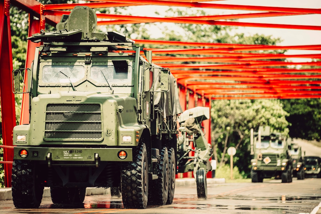 U.S. Marines assigned to Charlie Battery, Battalion Landing Team 1/5, 15th Marine Expeditionary Unit, conduct a convoy with 7-ton trucks and M777 towed 155 mm howitzers during exercise KAMANDAG 8 in Palawan Province, Philippines, Oct. 20, 2024. KAMANDAG is an annual Philippine Marine Corps and U.S. Marine Corps-led exercise aimed at enhancing the Armed Forces of the Philippines’ defense and humanitarian capabilities by providing valuable training in combined operations with foreign militaries in the advancement of a Free and Open Indo-Pacific. This year marks the eighth iteration of this exercise and includes participants from the French Armed Forces, Royal Thai Marine Corps, and Indonesian Marine Corps; including continued participation from the Australian Defense Force, British Armed Forces, Japan Ground Self-Defense Force, and Republic of Korea Marine Corps.  (U.S. Marine Corps photo by Cpl. Luis Agostini)