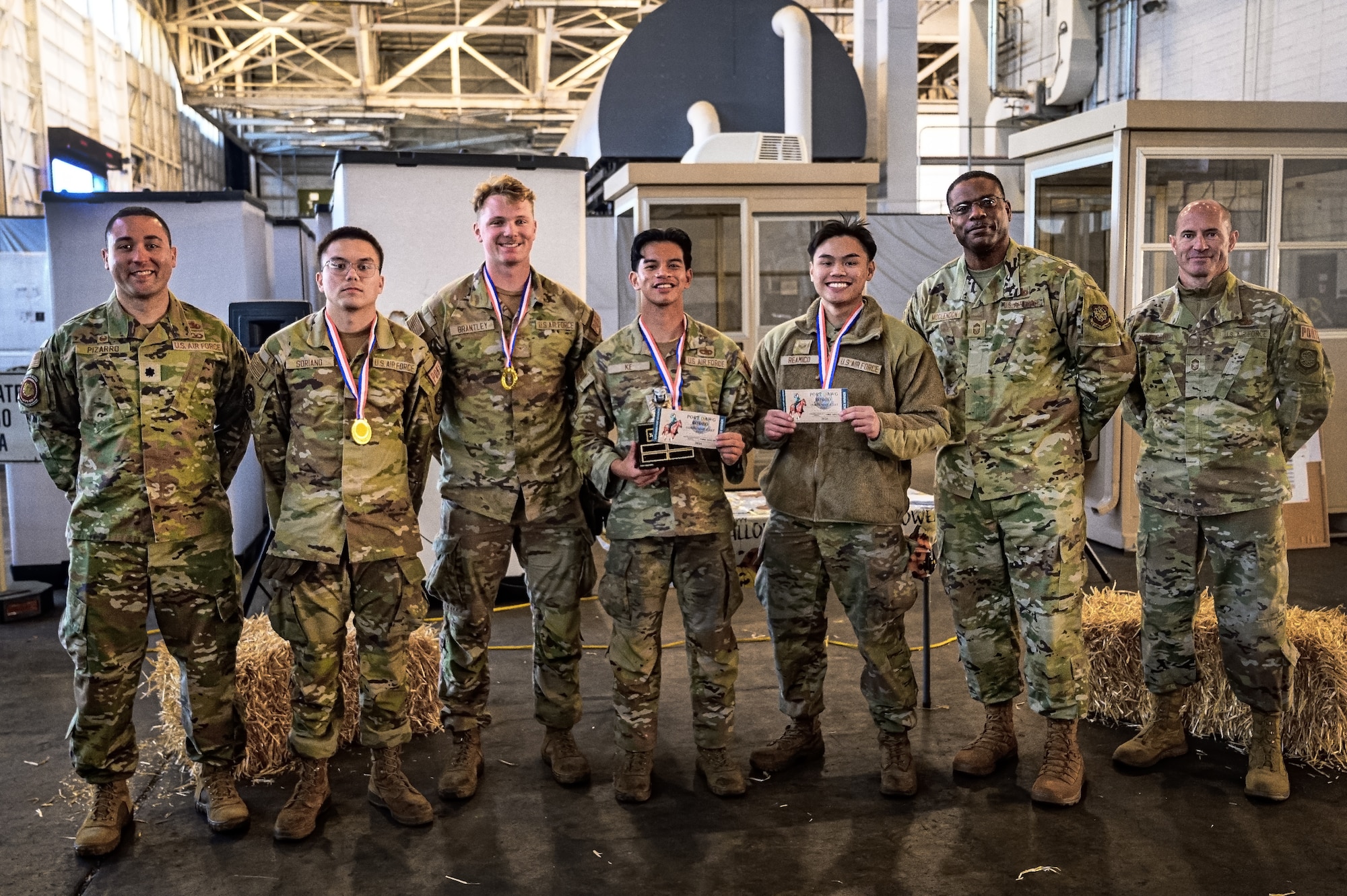 Winners of the Aerial Port Squadron Rodeo pose for a photo with 305th APS leadership at Joint Base McGuire-Dix-Lakehurst, N.J., Oct. 17, 2024. The APS Rodeo is an annual event held to showcase top performers in an array of transportation challenges that simulate what it is like to work in a high-tempo environment. (U.S. Air Force photo by Senior Airman Matt Porter)