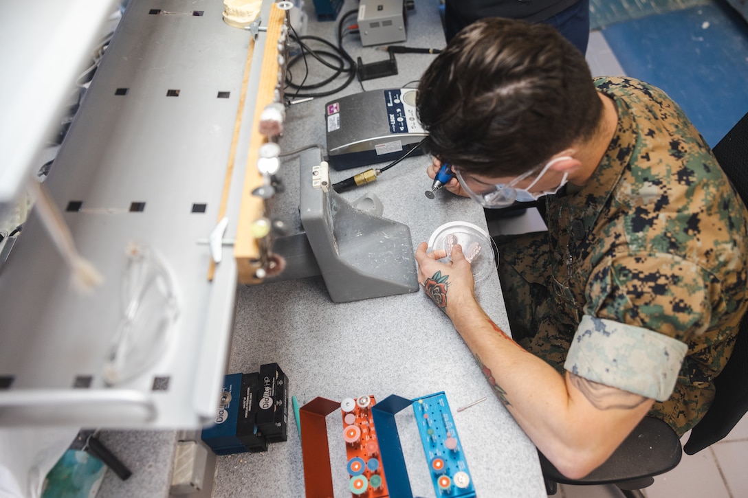 U.S. Navy Hospital Corpsman 3rd Class Ryan Robinson with 2nd Dental Battalion, 2nd Marine Logistics Group, II Marine Expeditionary Force, and a native of Sacramento, California, creates a tooth mold on Camp Lejeune, North Carolina, Oct. 22, 2024. According to Robinson’s leadership, he was selected as Warrior of the Week for his multifaceted approach to his work by fulfilling many roles outside of his military occupational specialty. Robinson has applied to be a Marine Corps Martial Arts Instructor and aided eight sailors in receiving their Fleet Marine Forces pin. When asked what his current goals are, Robinson replied, “My goal right now is to help develop Sailors at the command before I leave, so it's not really about me anymore, it's about all the Sailors that are here now and teaching them exactly what they should do, helping them reach their goals.” Each week, 2nd MLG recognizes one outstanding Marine or Sailor that goes above and beyond in their duties and embodies the qualities of an outstanding service member. (U.S. Marine Corps photos by Sgt. Mary Kohlmann)