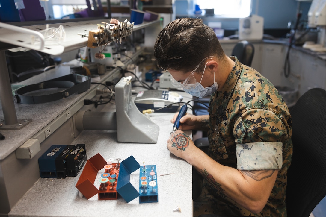 U.S. Navy Hospital Corpsman 3rd Class Ryan Robinson with 2nd Dental Battalion, 2nd Marine Logistics Group, II Marine Expeditionary Force, and a native of Sacramento, California, creates a tooth mold on Camp Lejeune, North Carolina, Oct. 22, 2024. According to Robinson’s leadership, he was selected as Warrior of the Week for his multifaceted approach to his work by fulfilling many roles outside of his military occupational specialty. Robinson has applied to be a Marine Corps Martial Arts Instructor and aided eight sailors in receiving their Fleet Marine Forces pin. When asked what his current goals are, Robinson replied, “My goal right now is to help develop Sailors at the command before I leave, so it's not really about me anymore, it's about all the Sailors that are here now and teaching them exactly what they should do, helping them reach their goals.” Each week, 2nd MLG recognizes one outstanding Marine or Sailor that goes above and beyond in their duties and embodies the qualities of an outstanding service member. (U.S. Marine Corps photos by Sgt. Mary Kohlmann)