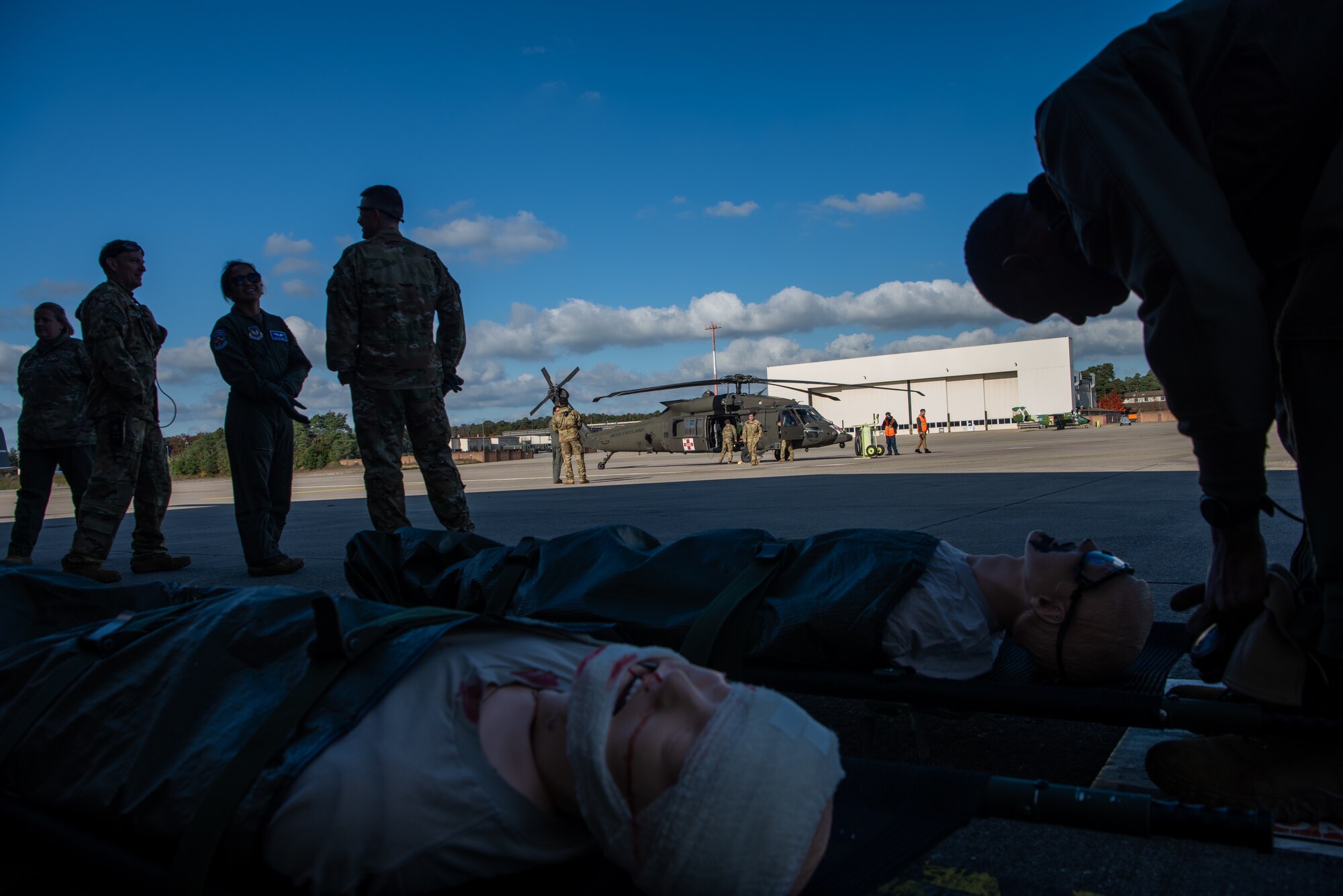 Mannequins sit on pavement before operation.