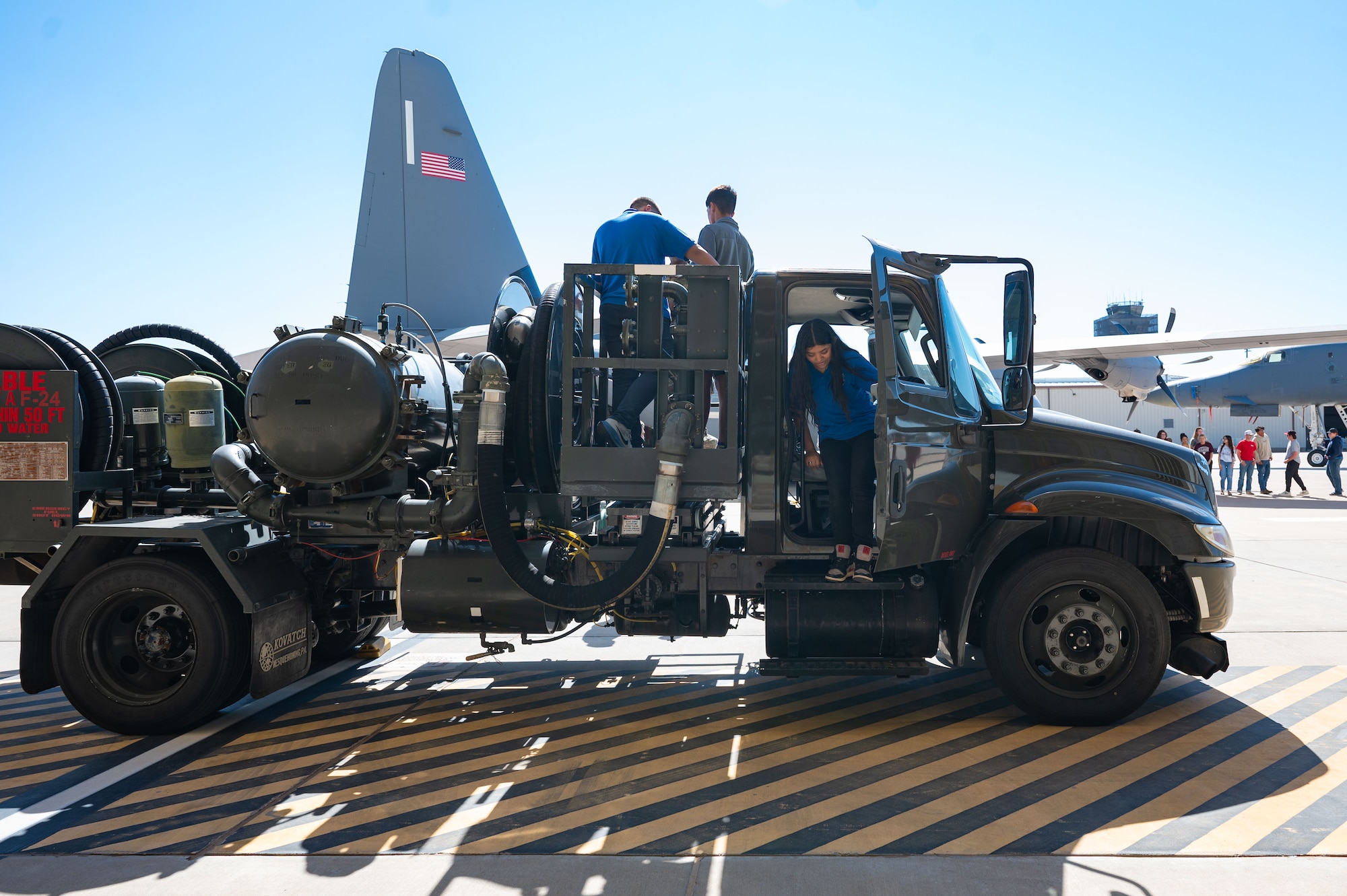 Abilene students tour a Petroleums, Oils, and Lubricants truck during a career fair at Dyess Air Force Base, Texas, Oct. 24, 2024. Students toured military aircraft and vehicles and spoke with various service members about their jobs. (U.S. Air Force photo by Airman 1st Class Emma Anderson)
