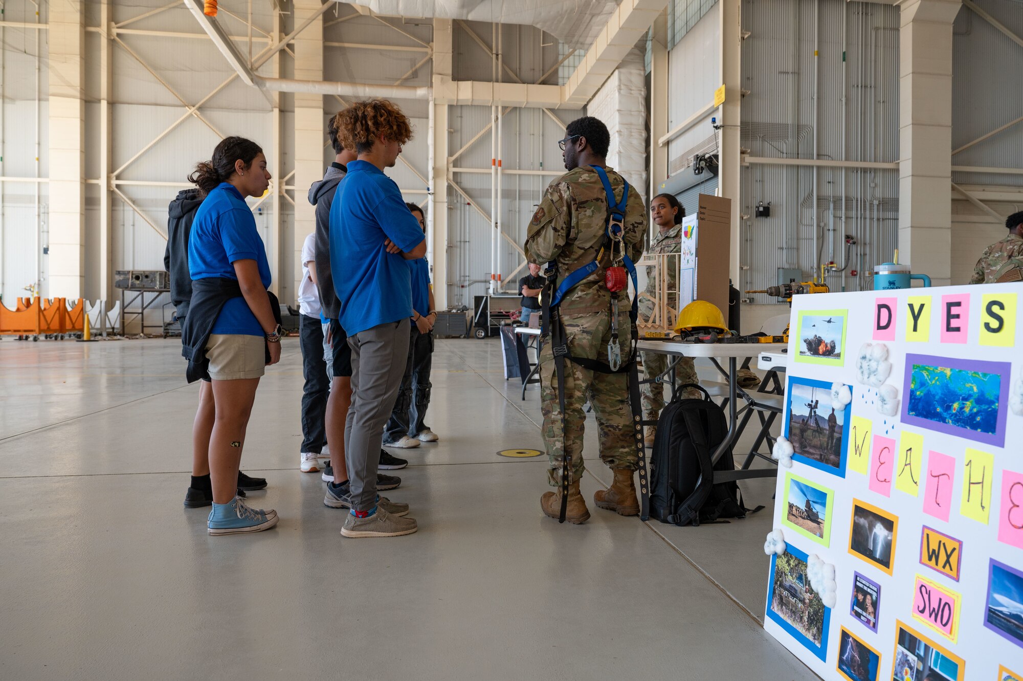 Abilene students speak with Dyess Airmen during a career fair at Dyess Air Force Base, Texas, Oct. 24, 2024. Career fairs give an opportunity to introduce students to the various career opportunities available within the Air Force. (U.S. Air Force photo by Airman 1st Class Emma Anderson)