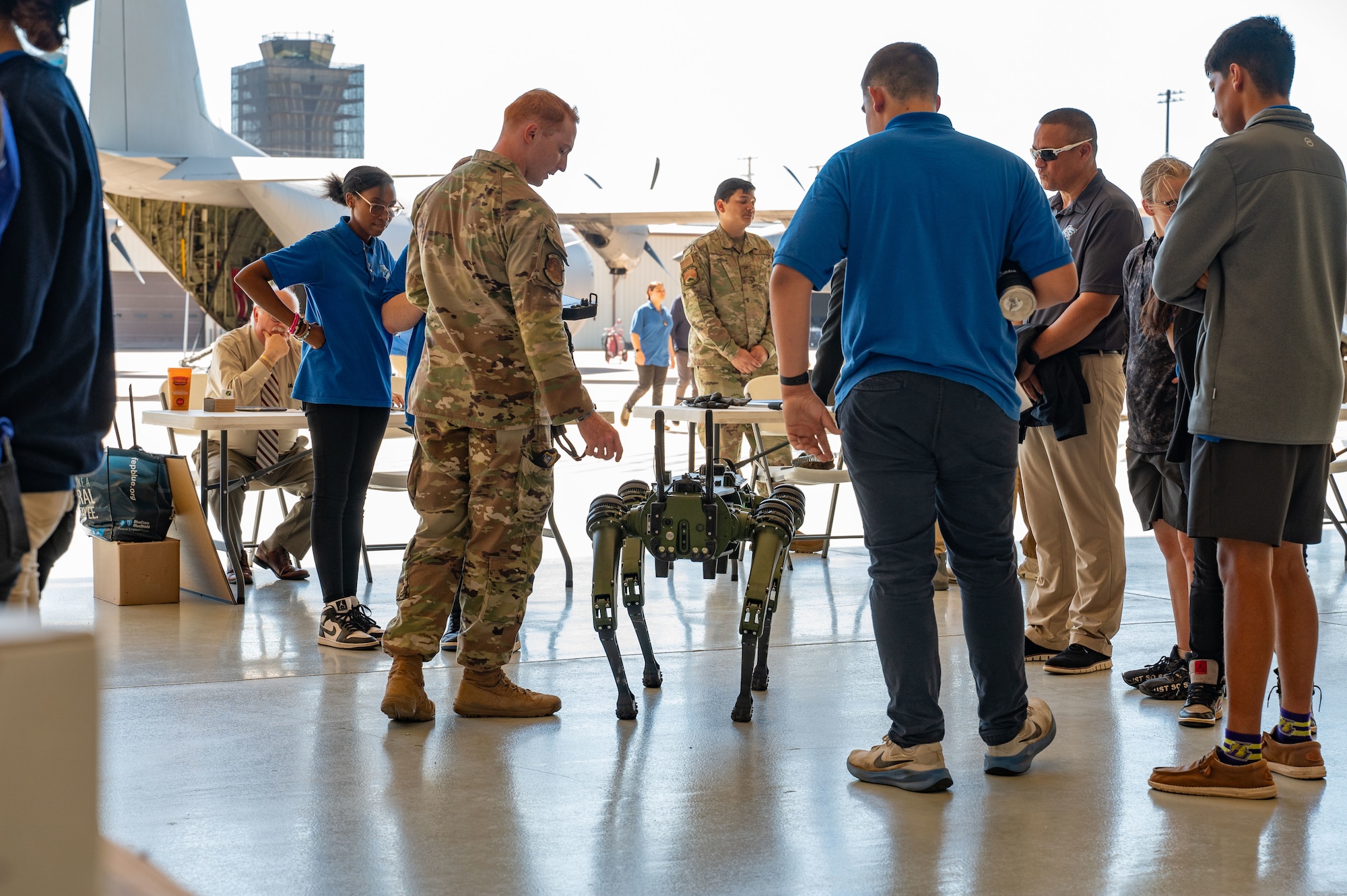 U.S. Air Force Staff Sgt. Christopher Boren, 7th Security Forces Squadron NCO in charge of systems and technology, performs a robotic dog demonstration during a career fair at Dyess Air Force Base, Texas, Oct. 24, 2024. Attendees spoke with active-duty members and were given insights into the skills, training, and benefits associated within the Air Force. (U.S. Air Force photo by Airman 1st Class Emma Anderson)