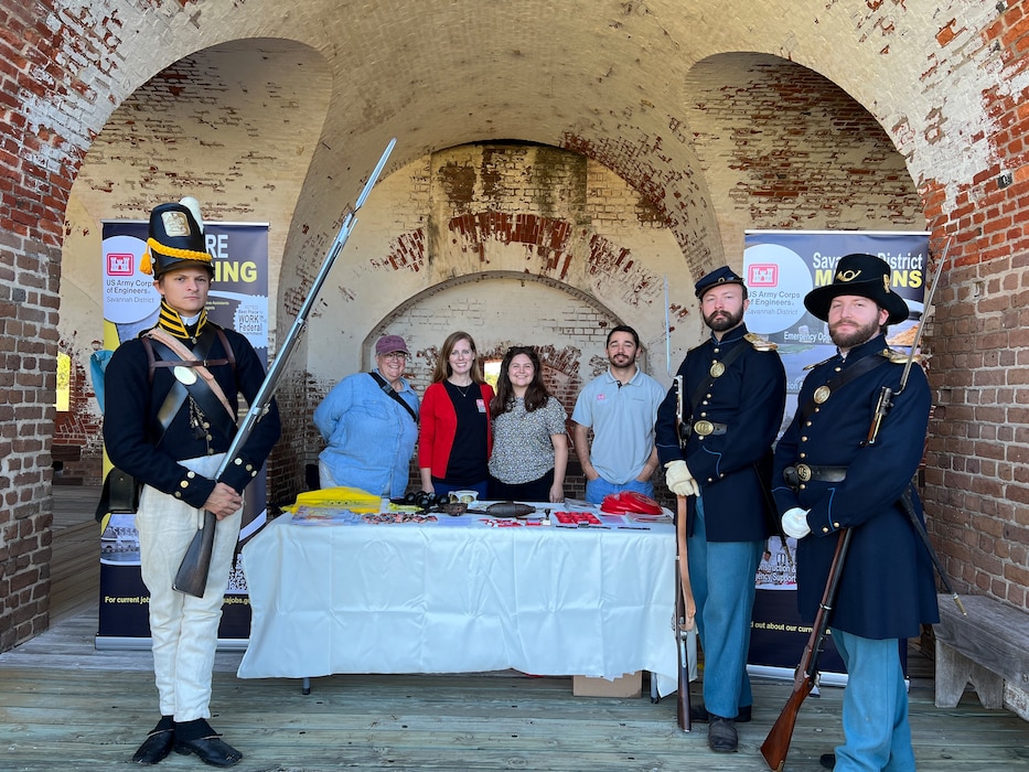 Personnel from the U.S. Army Corps of Engineers, Savannah District, pause for a photo at Fort Pulaski with members of the Coastal Heritage Society dressed in historical military uniforms, during the national monument’s centennial celebration, in Savannah, Georgia, October 13, 2024. The District team met with the public and educated them on the District’s mission, and its contributions to infrastructure, archeology, disaster relief, and environmental restoration.