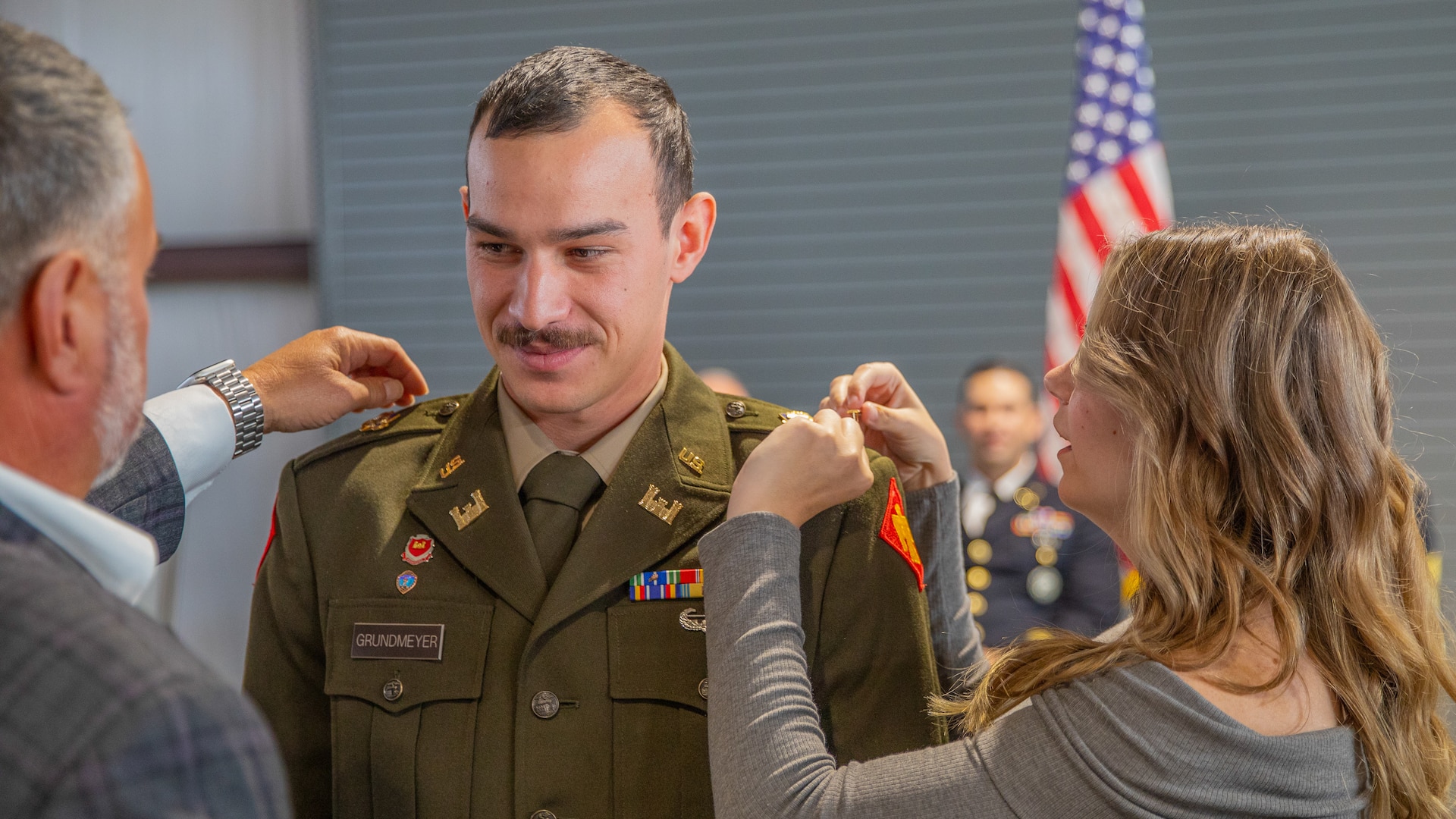 2nd Lt. Seth Grundmeyer, 545th Brigade Engineer Battalion, 45th Infantry Brigade Combat Team, is pinned his new rank during the commissioning ceremony for the Oklahoma Army National Guard’s Officer Candidate School Classes 69 and 70, held at Camp Gruber Training Center near Braggs, Oklahoma, Oct. 20, 2024. The ceremony honored 13 Soldiers who successfully completed all the requirements of the OCS program, making them newly commissioned second lieutenants in the Oklahoma Army National Guard. (Oklahoma National Guard photo by Sgt. Haden Tolbert)