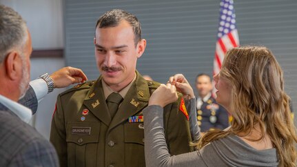 2nd Lt. Seth Grundmeyer, 545th Brigade Engineer Battalion, 45th Infantry Brigade Combat Team, is pinned his new rank during the commissioning ceremony for the Oklahoma Army National Guard’s Officer Candidate School Classes 69 and 70, held at Camp Gruber Training Center near Braggs, Oklahoma, Oct. 20, 2024. The ceremony honored 13 Soldiers who successfully completed all the requirements of the OCS program, making them newly commissioned second lieutenants in the Oklahoma Army National Guard. (Oklahoma National Guard photo by Sgt. Haden Tolbert)