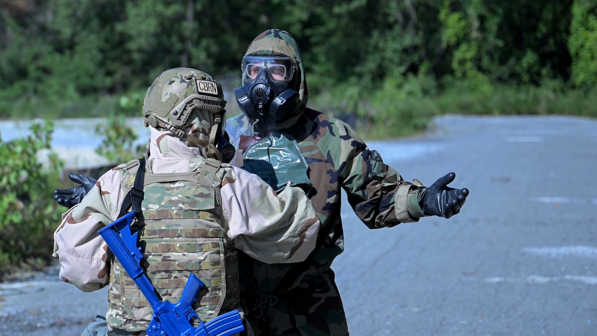 U.S. Air Force 1st Lt. Maria Reffner, flight commander at the Installation Office of Emergency Management, 316th Civil Engineer Squadron, uses M295 decontamination mitts to decontaminate Senior Airman Steven Fazakerley, training team member, during a Chemical, Biological, Radiological, and Nuclear training exercise at Joint Base Andrews, Md., Aug. 23, 2024. The mitts were crucial in removing contaminants from personnel and equipment, ensuring safety during simulated hazardous operations. (U.S. Air Force photo by Staff Sgt. Isaac March)