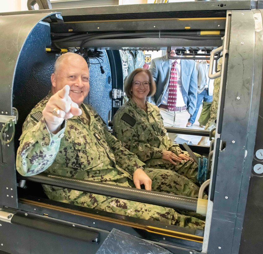 Chief of Naval Operations Adm. Lisa Franchetti and Master Chief Petty Officer of the Navy James Honea experience the Navy Sea, Air, and Land (SEAL) Team Delivery Vehicle (SDV) firsthand during their tour of Naval Surface Warfare Center Panama City Division, Oct. 24. In 1964, Panama City’s laboratory developed the first two-man SEAL Swimmer Delivery Vehicle systems and, today, the laboratory continues to produce a series of SDVs that are used worldwide by the special operations forces. (U.S. Navy photo by Eddie Green)
