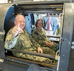 Chief of Naval Operations Adm. Lisa Franchetti and Master Chief Petty Officer of the Navy James Honea experience the Navy Sea, Air, and Land (SEAL) Team Delivery Vehicle (SDV) firsthand during their tour of Naval Surface Warfare Center Panama City Division, Oct. 24. In 1964, Panama City’s laboratory developed the first two-man SEAL Swimmer Delivery Vehicle systems and, today, the laboratory continues to produce a series of SDVs that are used worldwide by the special operations forces. (U.S. Navy photo by Eddie Green)
